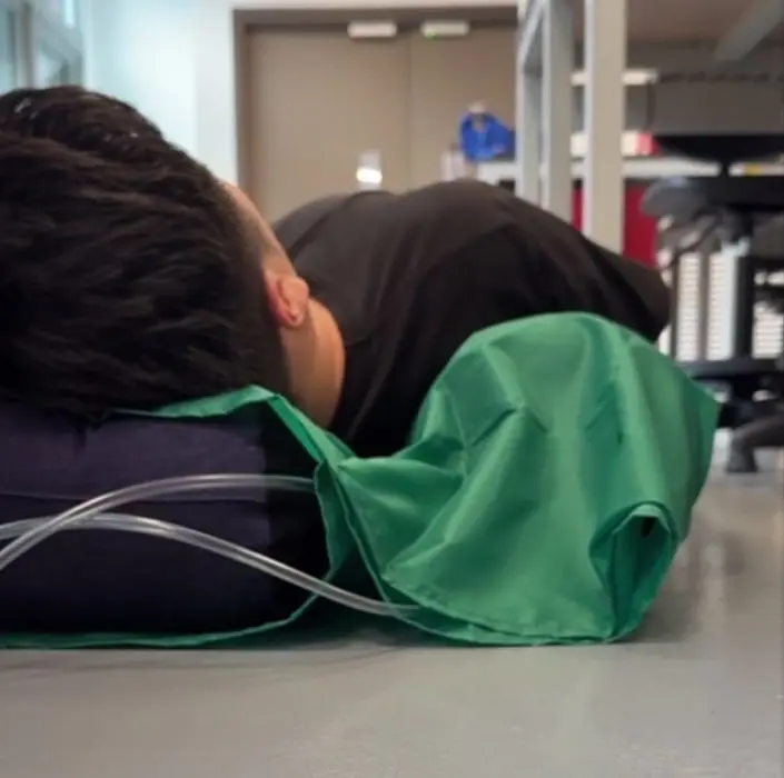 Inflated InflatAssist side support rotating a participant onto their side